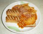 A poor attempt to make a "Meal in a can" edible by adding toast and sausage rolls.