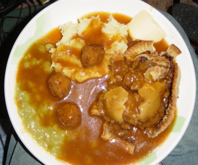 Meat and Potato Pie, Mash, Mushy Peas, Gravy, a few Meatballs and some Pease Pudding to add some erm, colour...