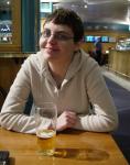 An Icelandic Woman, drinking Belgian Beer, in a "Mock British Pub" in the middle of an English Airport. You can't say 