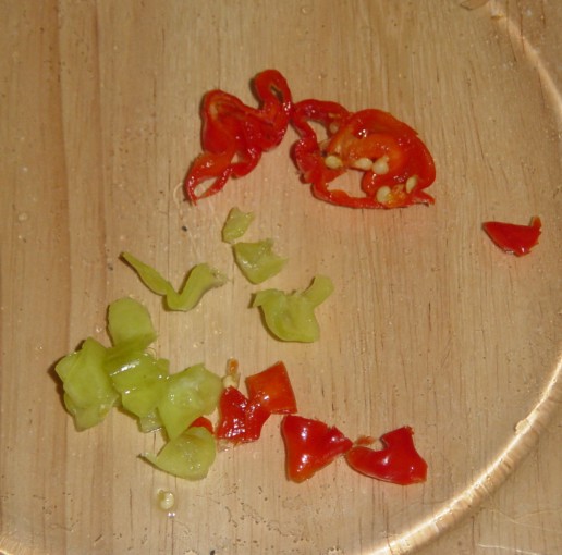 04: Choppy chilli, and leave some seeds in. Be careful where you scratch for the next few hours. These are Scotch Bonnets, they 