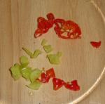 04: Choppy chilli, and leave some seeds in. Be careful where you scratch for the next few hours. These are Scotch Bonnets, they 